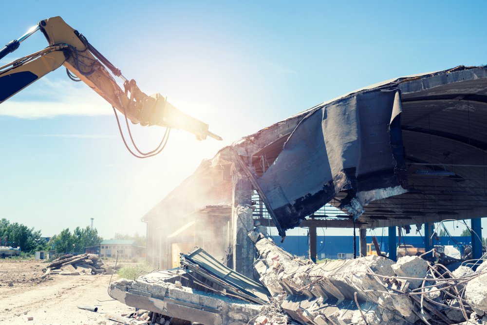 Old,Industrial,Buildings,Being,Demolished,And,Destroyed,By,Construction,Machines.
